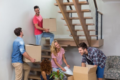 Furniture pick-up service collecting a sofa from a Twickenham home