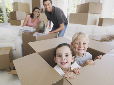 Removal company team handling boxes during a Twickenham home move