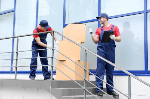 Moving professionals loading furniture during a Twickenham house or office move