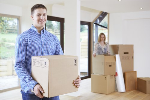 Movers carrying furniture during a professional relocation service