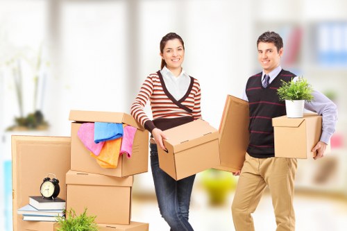 Removalists carrying items through a Twickenham residential street
