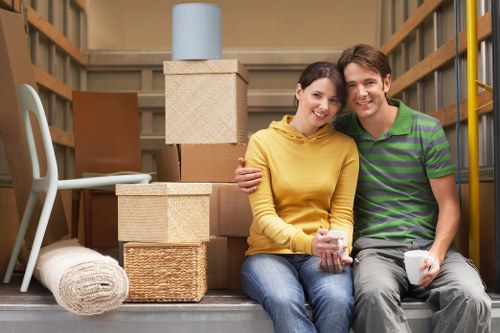 Careful wrapping of fragile household items during a packing service in Twickenham